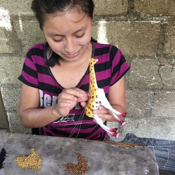 Creating a beaded animal in Guatemala